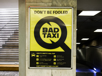 'Bad Taxi' warning poster is seen at the railway station in Warsaw, Poland on January 19, 2023. (