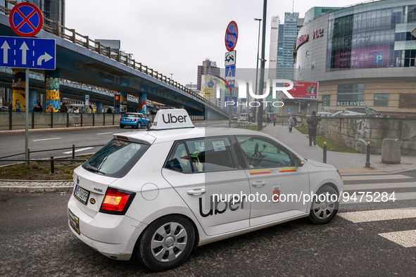 Uber taxi car is seen in the center of Warsaw, Poland on January 19, 2023. 