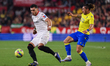 Karim Rekik of Sevilla FC competes for the ball with Alfonso ''Pacha'' Espino of Cadiz CF...