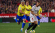 Joan Jordan of Sevilla FC competes for the ball with Brian Ocampo of Cadiz CF during the L...