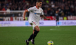 Erik Lamela of Sevilla FC runs with the ball during the La Liga Santader match between Sev...
