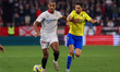 Loic Bade of Sevilla FC competes for the ball with Ruben Sobrino of Cadiz CF during the La...