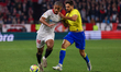 Loic Bade of Sevilla FC competes for the ball with Ruben Sobrino of Cadiz CF during the La...