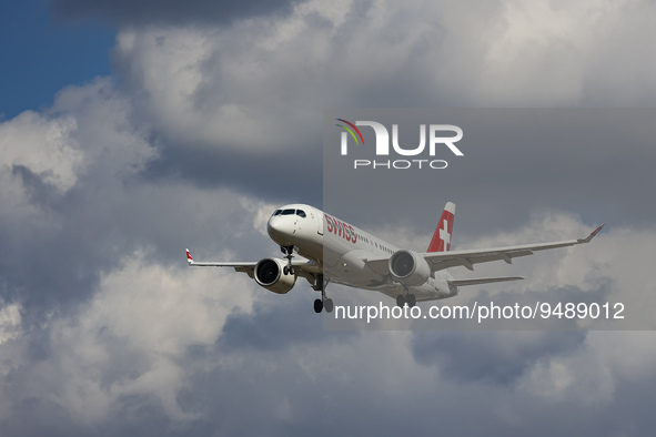Swiss Airbus A220-300 aircraft or former Bombardier CS300 BD-500 model, as seen on final approach flying for landing at the runway of London...