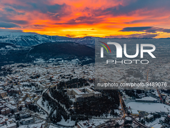 Forte Spagnolo castle is seen in a sunset aerial drone view after a snowfall in L'Aquila, Italy, on January 23, 2023. Central Italy is invol...