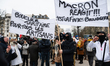 Demonstrators hold up banners reading ''Macron reacts, it's the end of bakeries'' and ''Ta...
