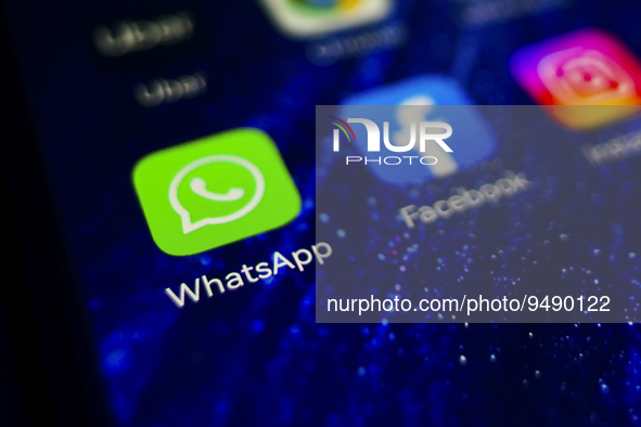WhatsApp app logo is displayed on a mobile phone screen for illustration photo. Krakow, Poland on January 23, 2023. 