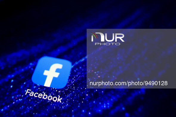 Facebook app logo is displayed on a mobile phone screen for illustration photo. Krakow, Poland on January 23, 2023. 