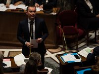 Labour Minister Olivier Dussopt speaks during the question session to the government, in Paris, Tuesday 24 January, 2023. (