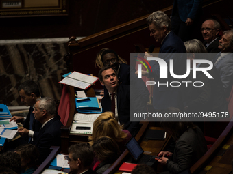 NUPES deputy Fabien Roussel takes the floor under the critical gaze of government spokesman Olivier Veran, during the question session to th...