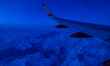 A view of easyJet wing over the Alps covered with snow during a flight from Milano Malpens...