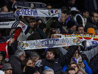 Supporters during the Copa del Rey match between Real Madrid and Atletico de Madrid at Estadio Santiago Bernabeu in Madrid, Spain. (