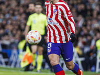 Antoine Griezmann of Atletico de Madrid in action during the Copa del Rey match between Real Madrid and Atletico de Madrid at Estadio Santia...