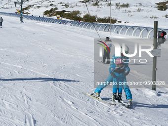A mother tries to teach her young son to ski in the ski and mountain resort of Alto Campoo or Branavieja, which is located in the municipali...