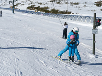 A mother tries to teach her young son to ski in the ski and mountain resort of Alto Campoo or Branavieja, which is located in the municipali...