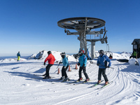 Young people enjoying the sport of skiing in the ski and mountain resort of Alto Campoo or Branavieja which is located in the municipality o...