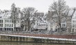 Snow in Maastricht with cold weather. Daily life and general view scenes of the river bank...