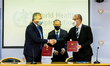 Michalis Hadjipantela and Dr. Hans Henri P. Kluge, shake hands after the signing, Nicosia,...