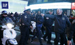 A man is detained after his arrest for vandalizing a NYPD car  in Times Square as the beat...