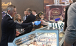 A worker giving an ice cream test to a customer is seen during edition number 45 of SIGEP...