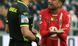 Armando Izzo (AC Monza) disputes with referee of the match Gianluca Aureliano during the i...