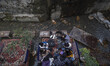 A group of young Iranian women sit at an outdoor cafe on a riverside in Darband neighborho...