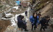 Two Iranian young woman walk along an area in Darband neighborhood in northern Tehran, Dec...