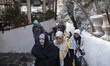 A group of Iranian women walk along an area in Darband neighborhood in northern Tehran, De...