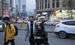 Iranian youths walk along an avenue in northern Tehran at sunset, January 30, 2023. Since...