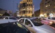 Vehicles are stoped on an avenue in northern Tehran at sunset, January 30, 2023. Since the...