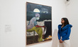 LONDON, UNITED KINGDOM - FEBRUARY 09, 2023: A gallery staff member looks at a painting tit...