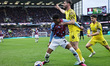 Nathan Tella of Burnley is manhandled by Andrew Hughes of Preston North End during the Sky...