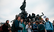 Many young demonstrators gather and climb the statue of the Nation during the trade union...