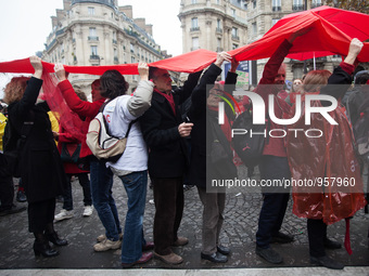 Demonstrators hold up red lines symbolizing planetary boundries during the D12 demonstrations during the last day of COP21 on Avenue De La G...