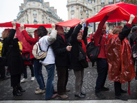 Demonstrators hold up red lines symbolizing planetary boundries during the D12 demonstrations during the last day of COP21 on Avenue De La G...