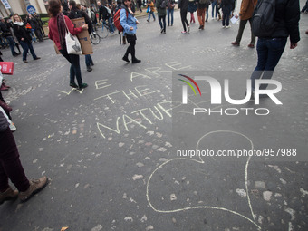 A protestor wrote "We are the nature" on the pavement when an estimated 15,000 demonstrators took to the streets and marsched from Avenue De...