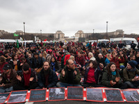 Climate demonstrators sit-in to occupy the bridge Pont D'iéna in front of the Eiffel Tower when an estimated 15,000 demonstrators took to th...