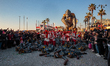 A giant paper-mache carnival  with a Gorilla representing war and misery of the world  flo...