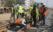 Workers are seen busy as they rebuild the Dhaka-Narayangonj railway track in Dhaka, Bangla...