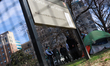 Police speak to a person who refuses to vacate McPherson Square in Washington, D.C. as aut...