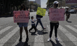 Demonstrators hold banners outside the Mexico City Judiciary as they demand justice for th...