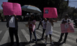 Demonstrators hold banners outside the Mexico City Judiciary as they demand justice for th...