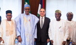President Muhammadu Buhari with the  Chairman Flour Mills Nigeria Ltd Mr John Coumantaros,...