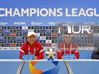 Ruzikul Berdiev, head coach of Uzbekistans FC Nasaf and player Husayn Norchaev attend the press conference ahead of the round of 16 match ag...