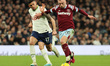 West Ham United's Jarrod Bowen holds of Tottenham Hotspur's Cristian Romero during the Eng...
