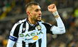 Udinese's Roberto Maximiliano Pereyra celebrates after scoring a goal 2-1 and show the cuf...