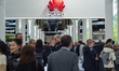 Visitors walk at the Huawei at the Mobile World Congress 2023 (MWC), the telecom industry'...