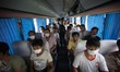 Refugees seen wearing face masks in order to protect themselves from the toxic air which h...