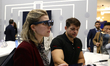 A congress visitor trying the new TCL RayNeo X2, a pair of augmented reality glasses from...
