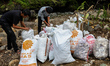 A small group of volunteers worked to clean up styrofoam from the Ciliwung River in Bogor,...